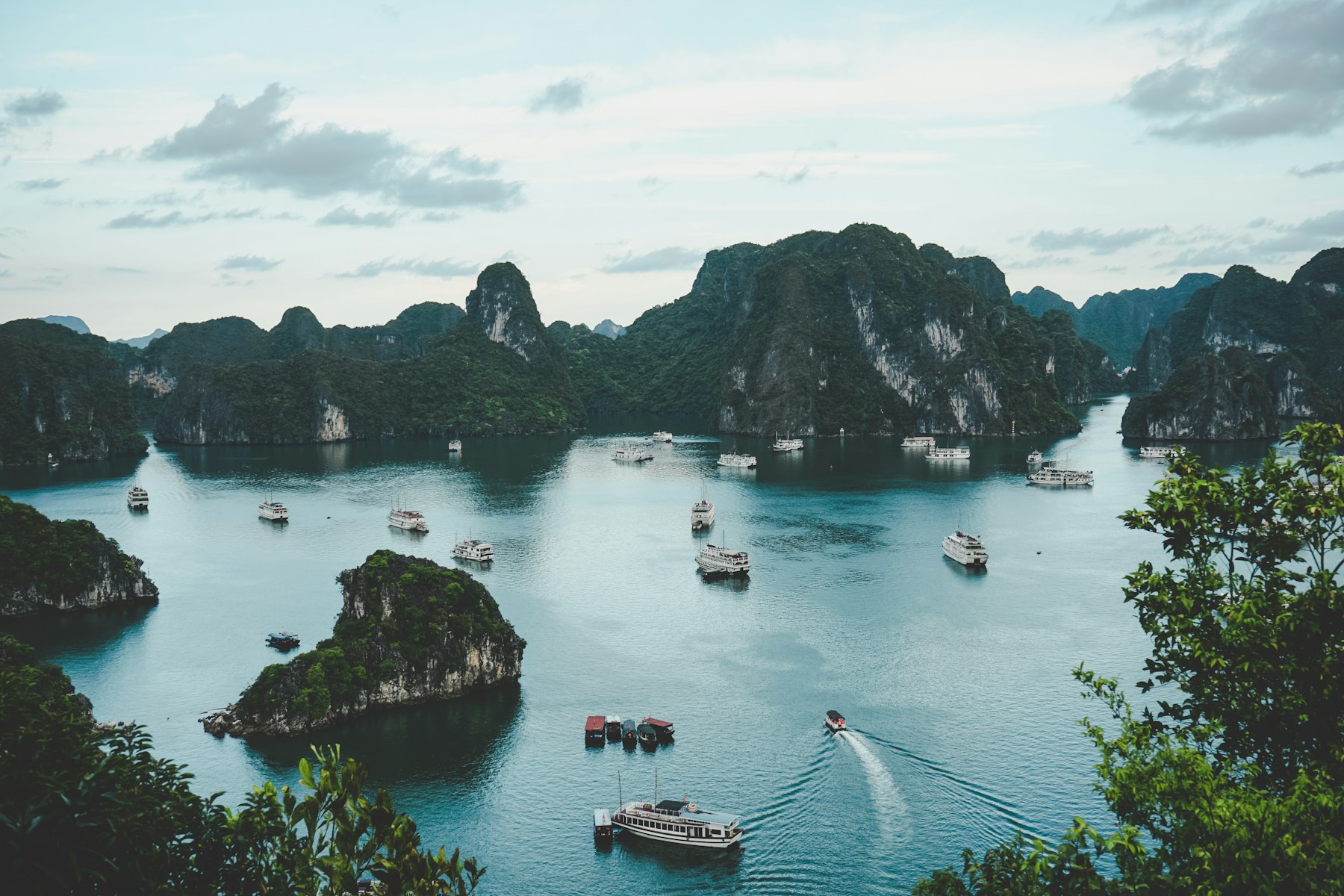 Limestone islands and cruise boats in Ha Long Bay